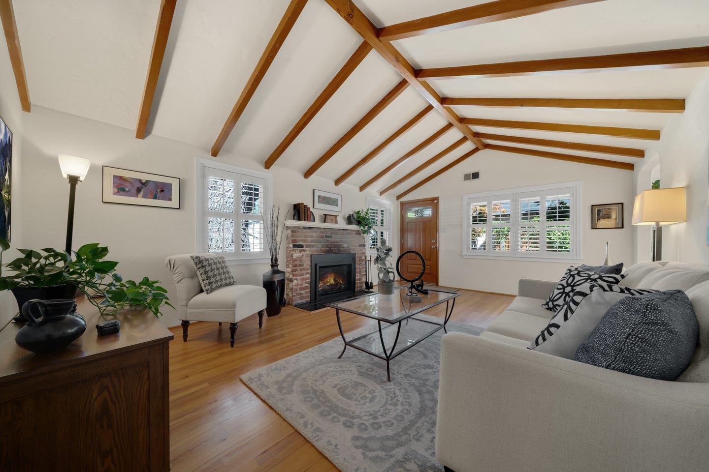 78 Cherry Lane Campbell, CA 95008 - Photo 16 of 49 a living room with furniture a fireplace and potted plants