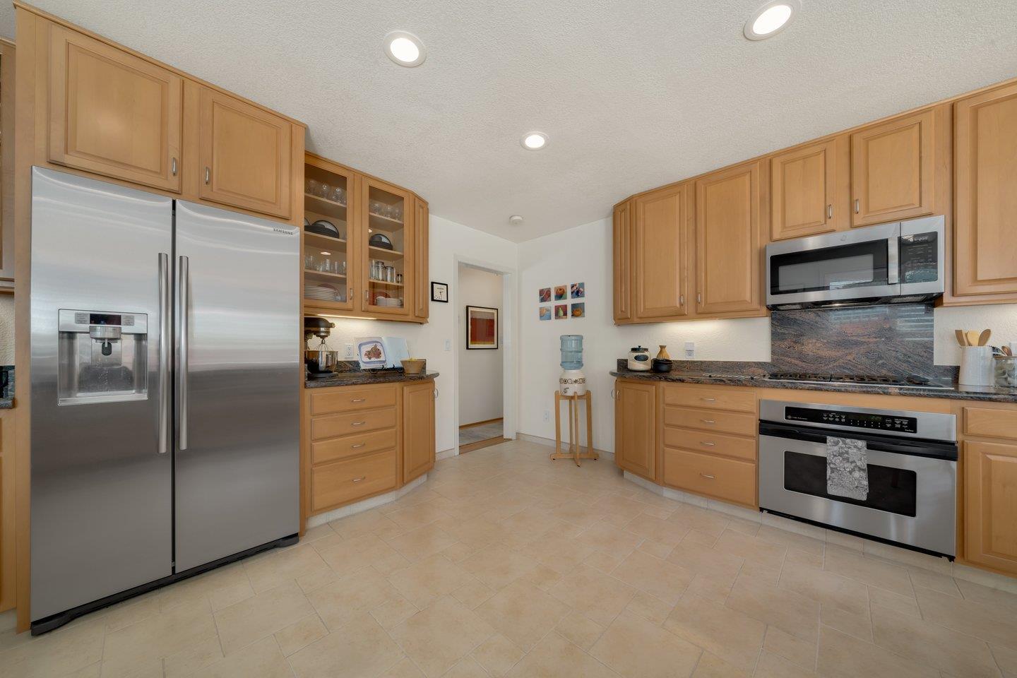 78 Cherry Lane Campbell, CA 95008 - Photo 17 of 49 a kitchen with stainless steel appliances granite countertop a refrigerator a stove a sink and a microwave