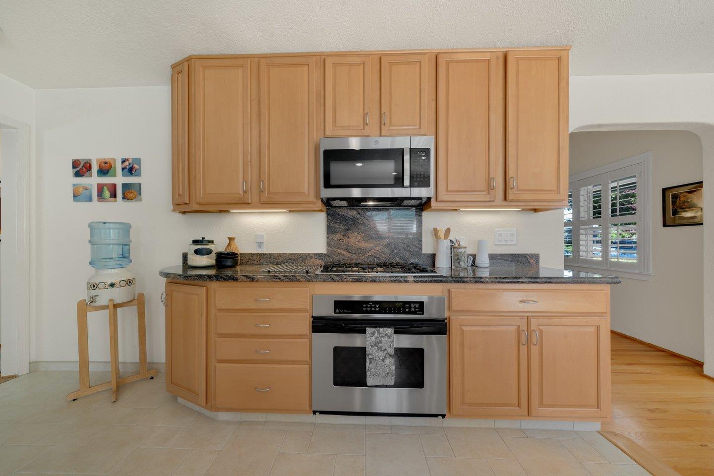 78 Cherry Lane Campbell, CA 95008 - Photo 19 of 49 a kitchen with stainless steel appliances granite countertop a stove a sink and a microwave