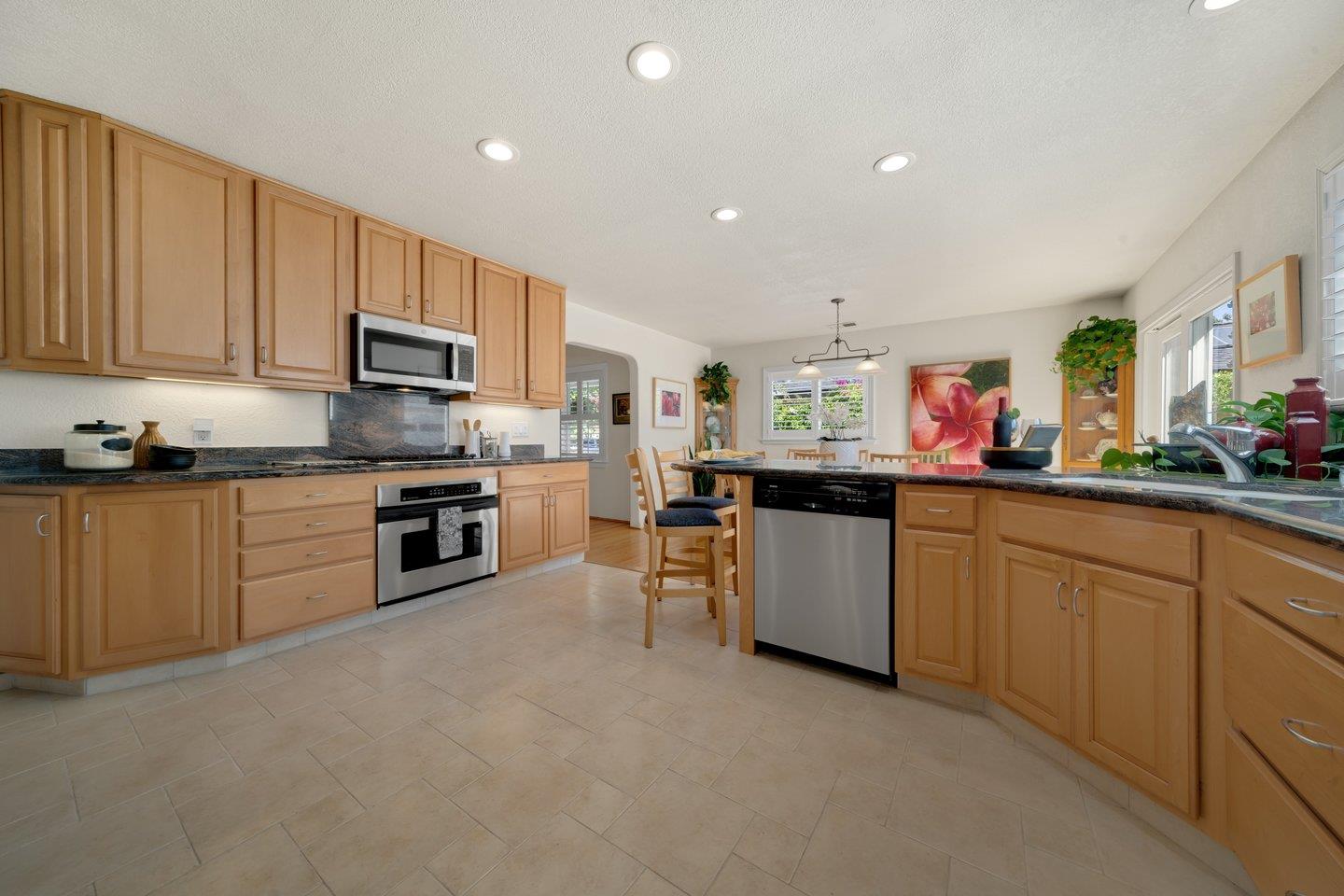 78 Cherry Lane Campbell, CA 95008 - Photo 22 of 49 a kitchen with stainless steel appliances granite countertop a refrigerator sink and stove