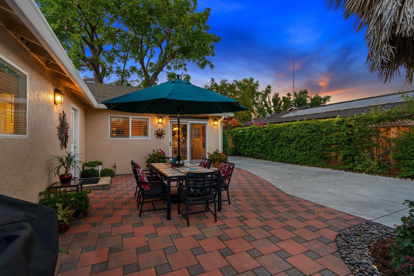 78 Cherry Lane Campbell, CA 95008 - Photo 45 of 49 a view of a patio with a table and chairs under an umbrella