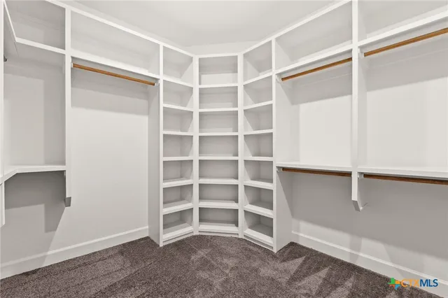 a view of an empty room with empty racks