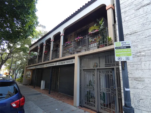 a front view of a house with parking space