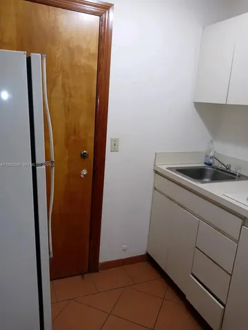 a kitchen with a sink and washing machine
