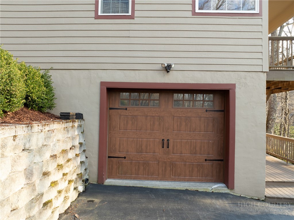 126 Moore Mountain Road Vilas, NC 28692 - Photo 28 of 41 a front view of a house with a garage