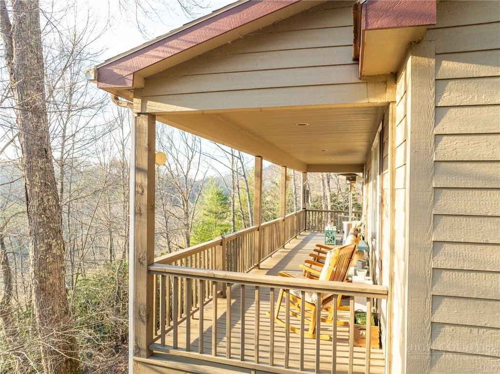 126 Moore Mountain Road Vilas, NC 28692 - Photo 32 of 41 a view of a balcony with wooden floor