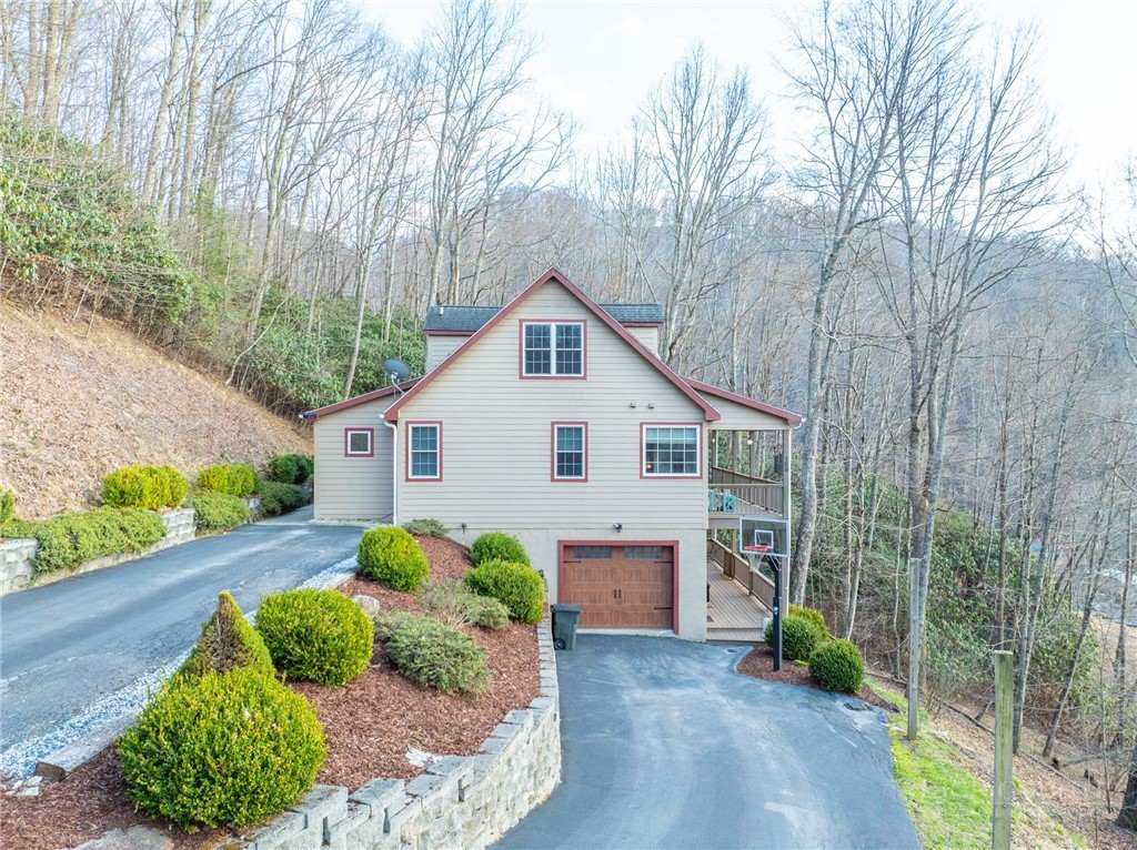 126 Moore Mountain Road Vilas, NC 28692 - Photo 38 of 41 a front view of a house with garden