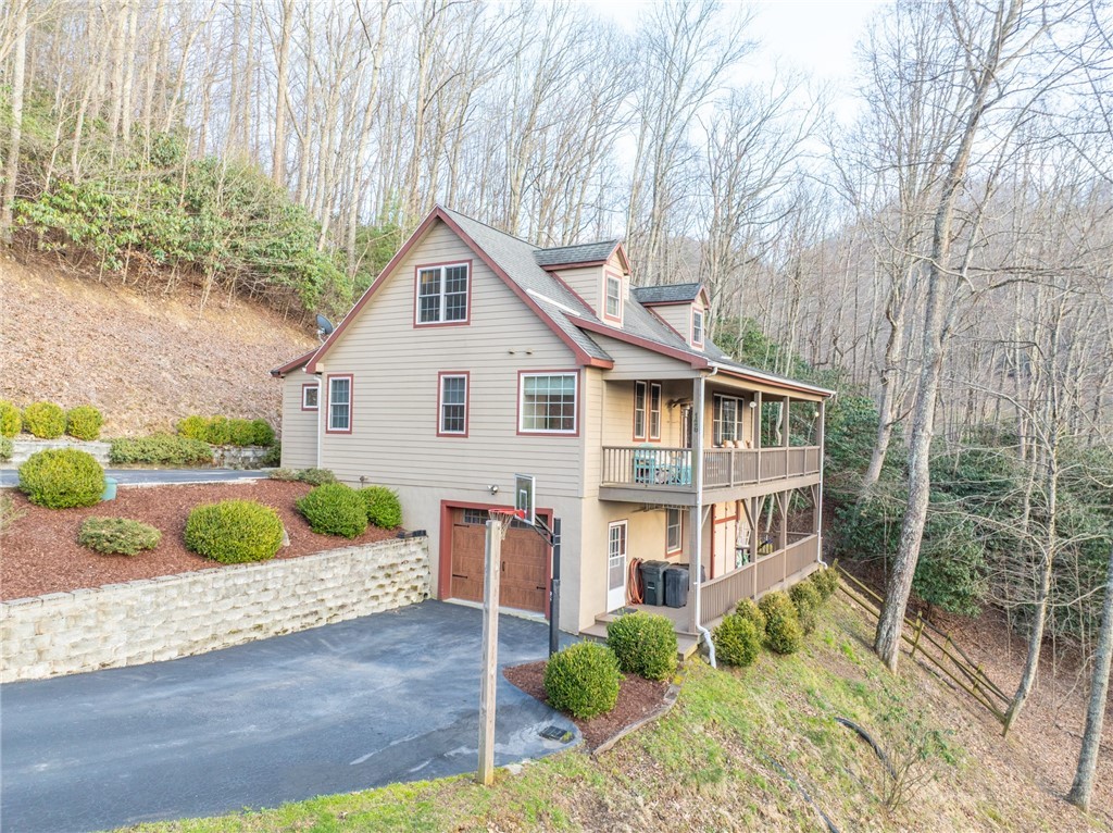 126 Moore Mountain Road Vilas, NC 28692 - Photo 40 of 41 a front view of a house with garden