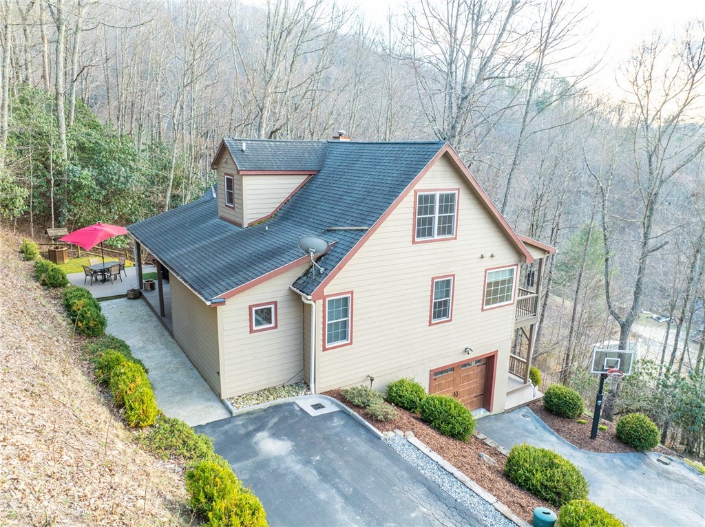 126 Moore Mountain Road Vilas, NC 28692 - Photo 41 of 41 a front view of a house with a yard