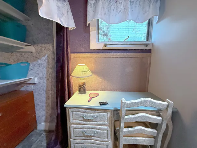 a stove top oven sitting inside of a kitchen