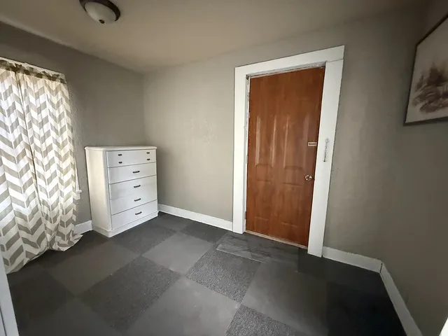 a view of an empty room and window