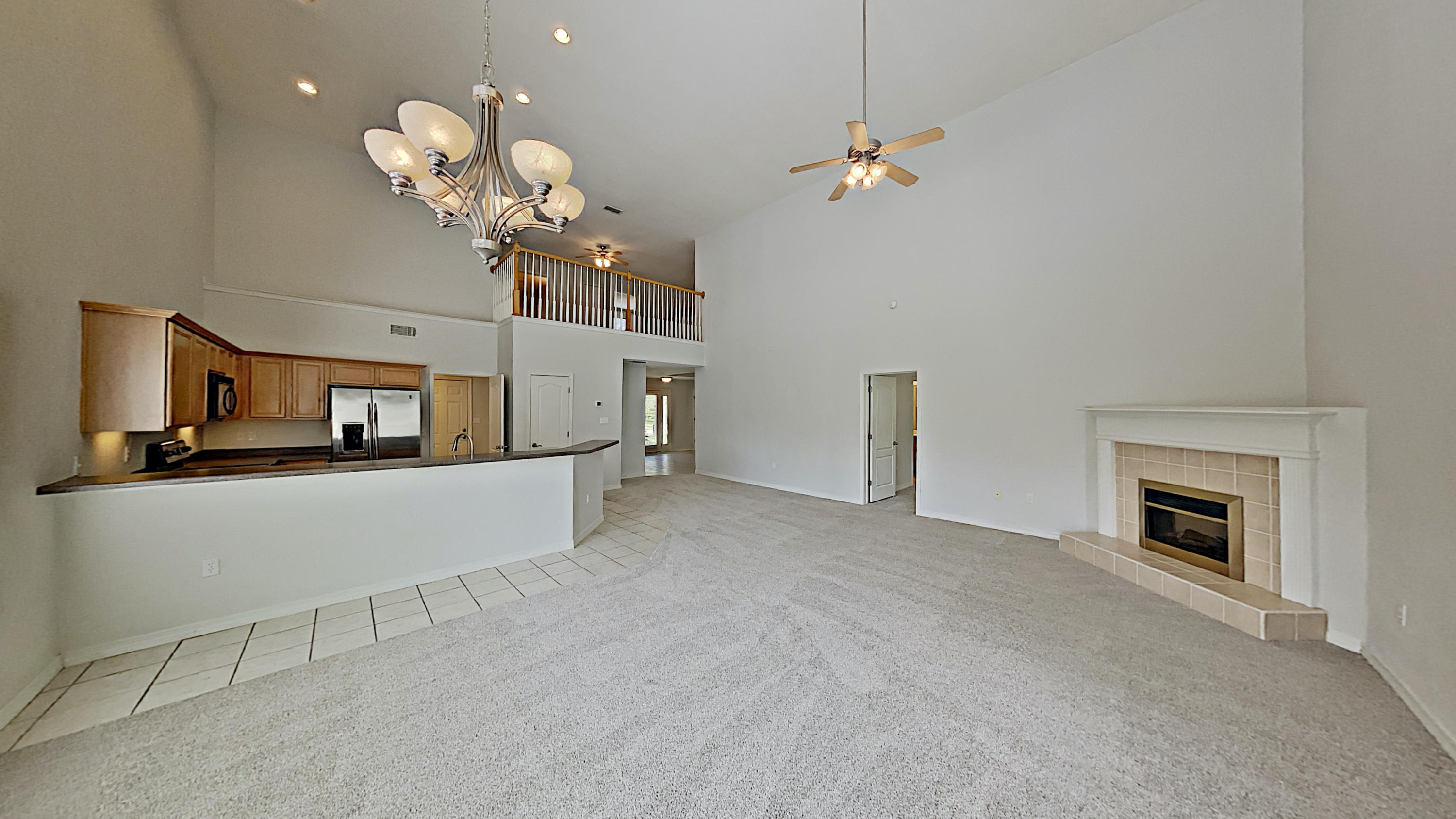 113 Red Maple Court Santa Rosa Beach, FL 32459 - Photo 11 of 36 a view of kitchen and hallway with a chandelier
