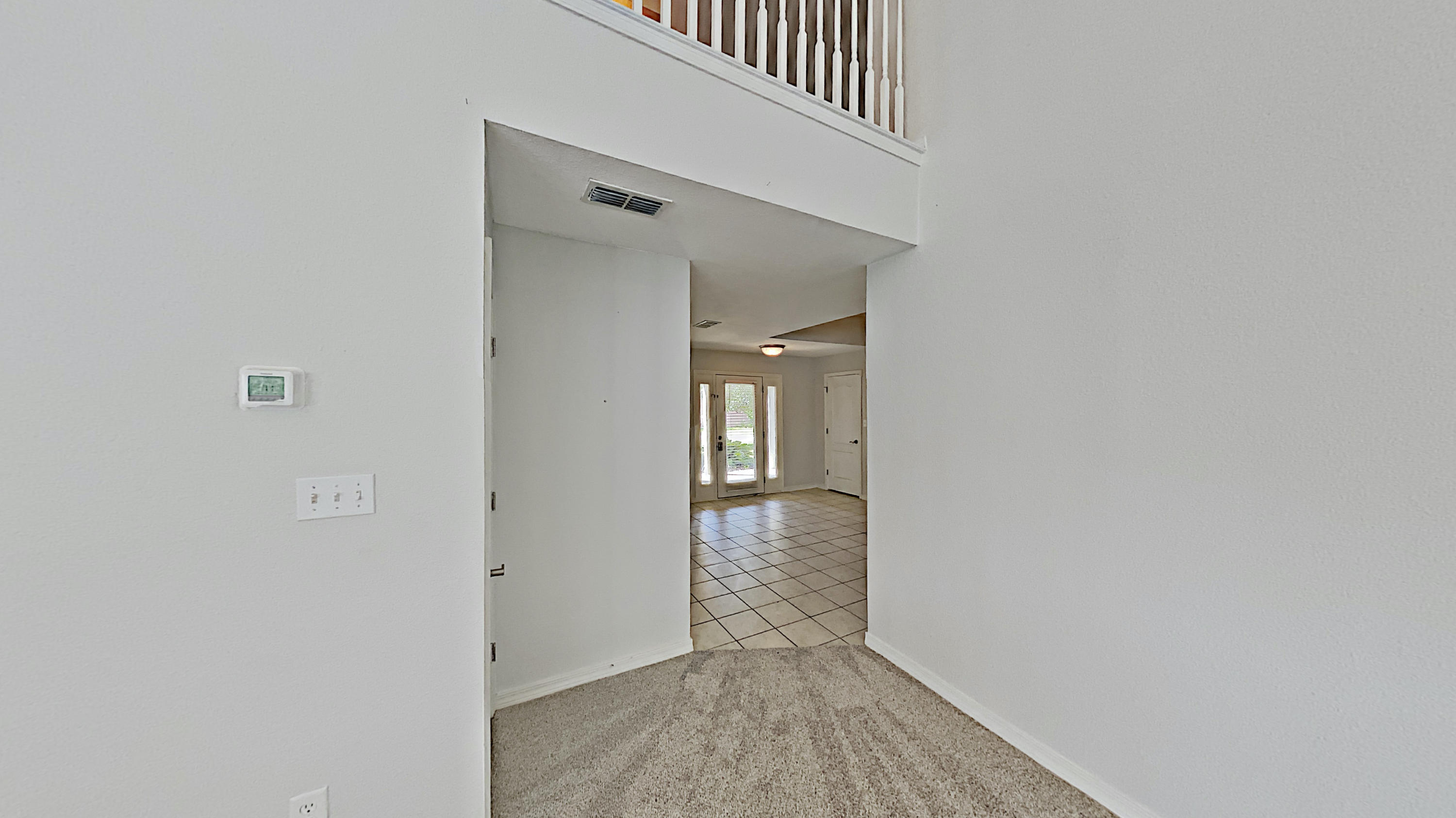 113 Red Maple Court Santa Rosa Beach, FL 32459 - Photo 13 of 36 a view of a hallway with wooden floor and entryway