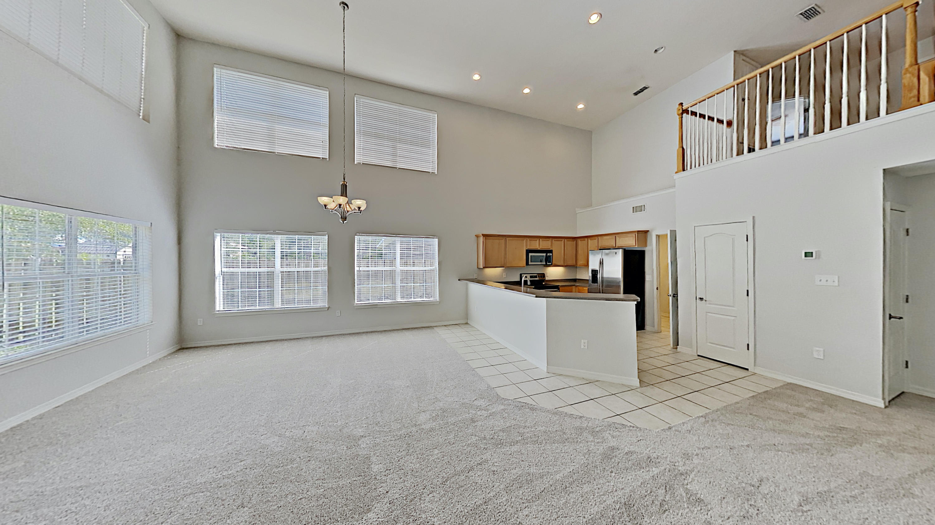 113 Red Maple Court Santa Rosa Beach, FL 32459 - Photo 2 of 36 a living room with furniture and a open kitchen