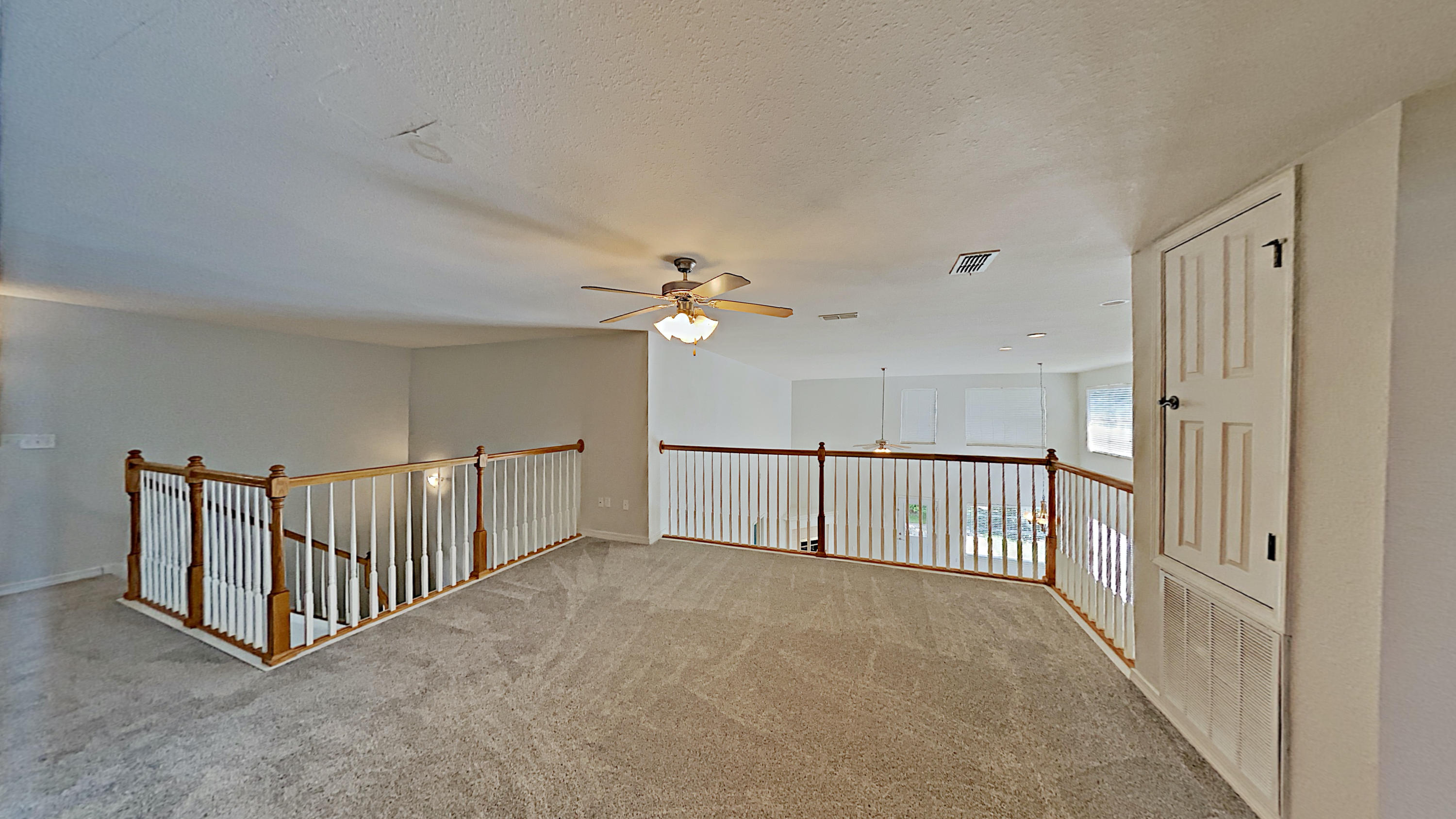 113 Red Maple Court Santa Rosa Beach, FL 32459 - Photo 30 of 36 a view of a hallway with chandelier fan