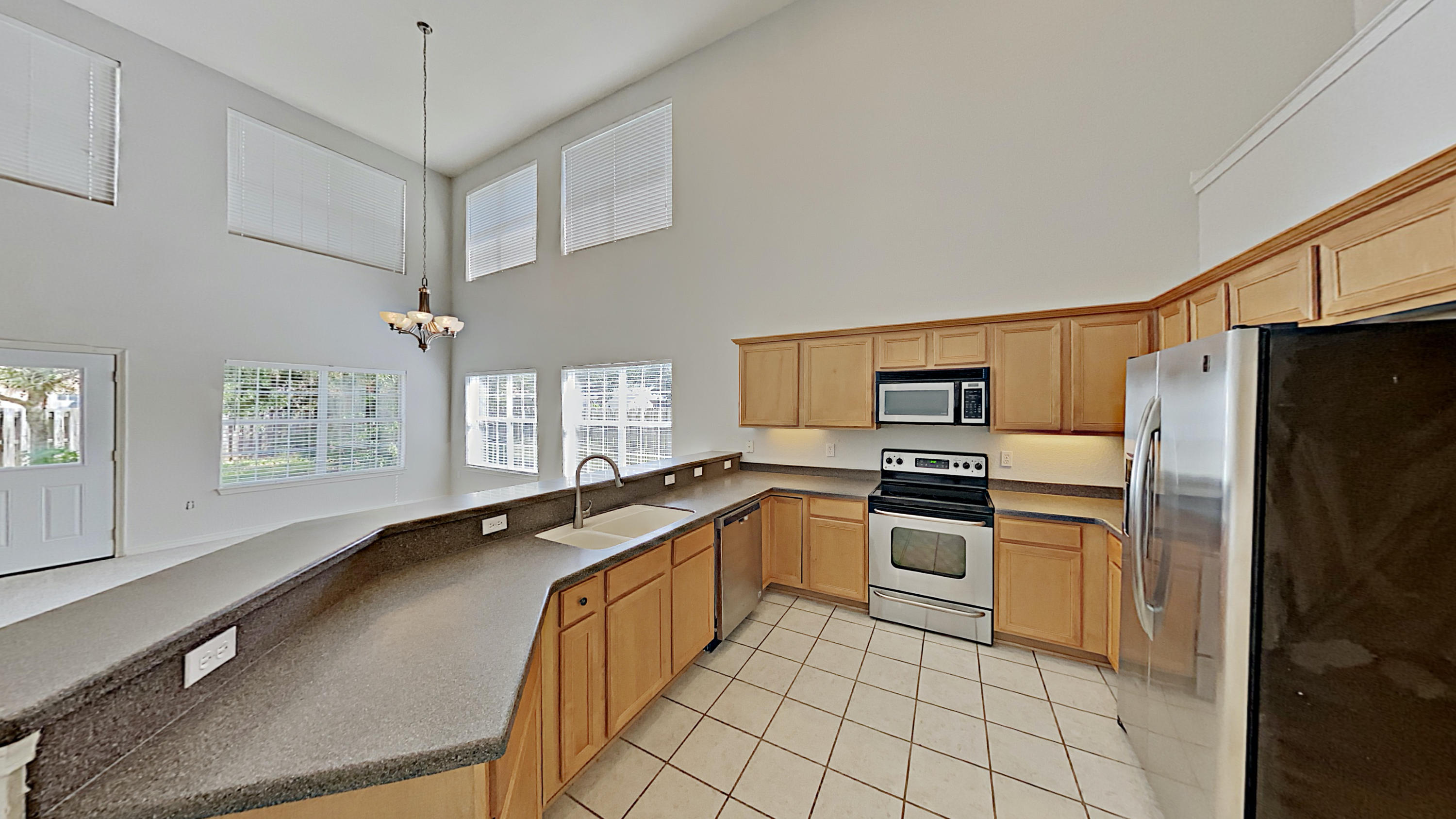 113 Red Maple Court Santa Rosa Beach, FL 32459 - Photo 8 of 36 a kitchen with granite countertop a sink stainless steel appliances and cabinets