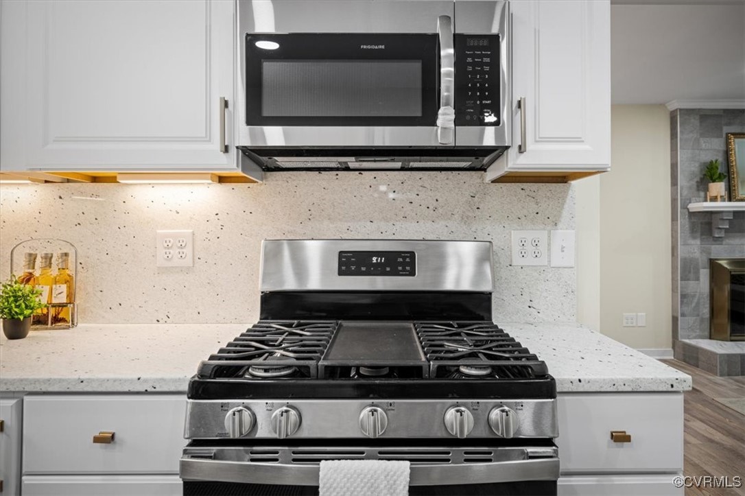 6920 Belmont Road Chesterfield, VA 23832 - Photo 20 of 50 Kitchen featuring white cabinetry, light stone cou