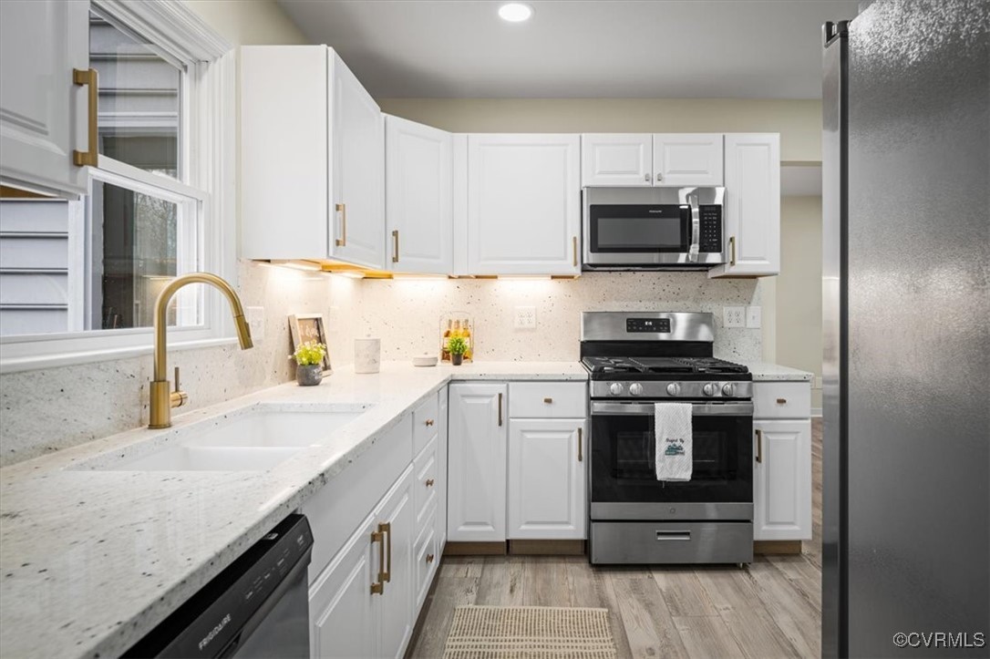 6920 Belmont Road Chesterfield, VA 23832 - Photo 22 of 50 Kitchen featuring white cabinetry, sink, stainless