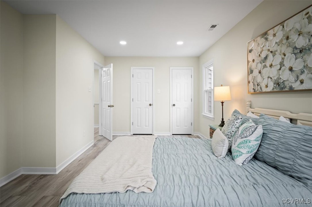 6920 Belmont Road Chesterfield, VA 23832 - Photo 36 of 50 Bedroom featuring multiple closets and wood-type f
