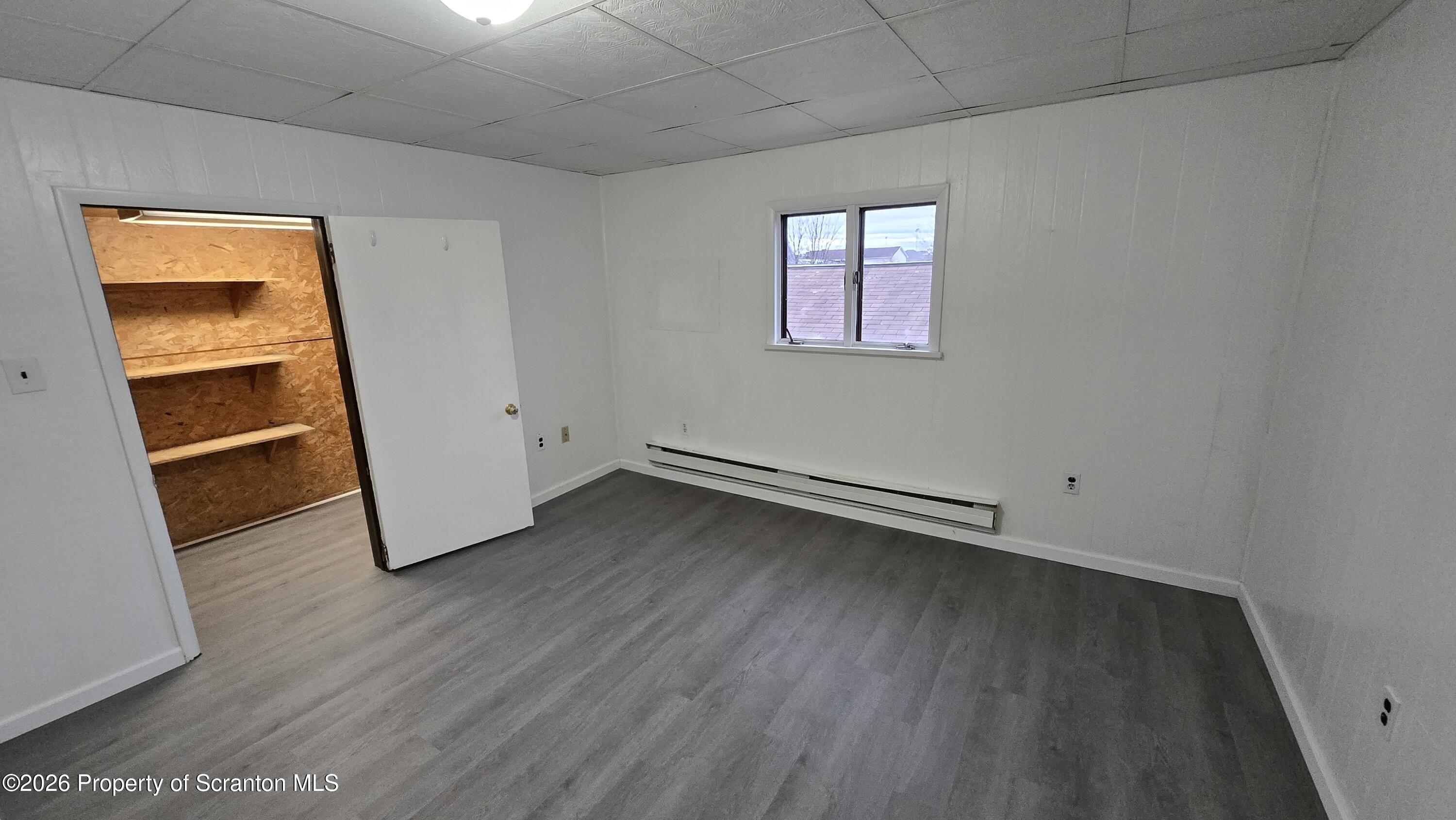 1026 Meade Avenue Scranton, PA 18508 - Photo 11 of 12 an empty room with wooden floor and closet