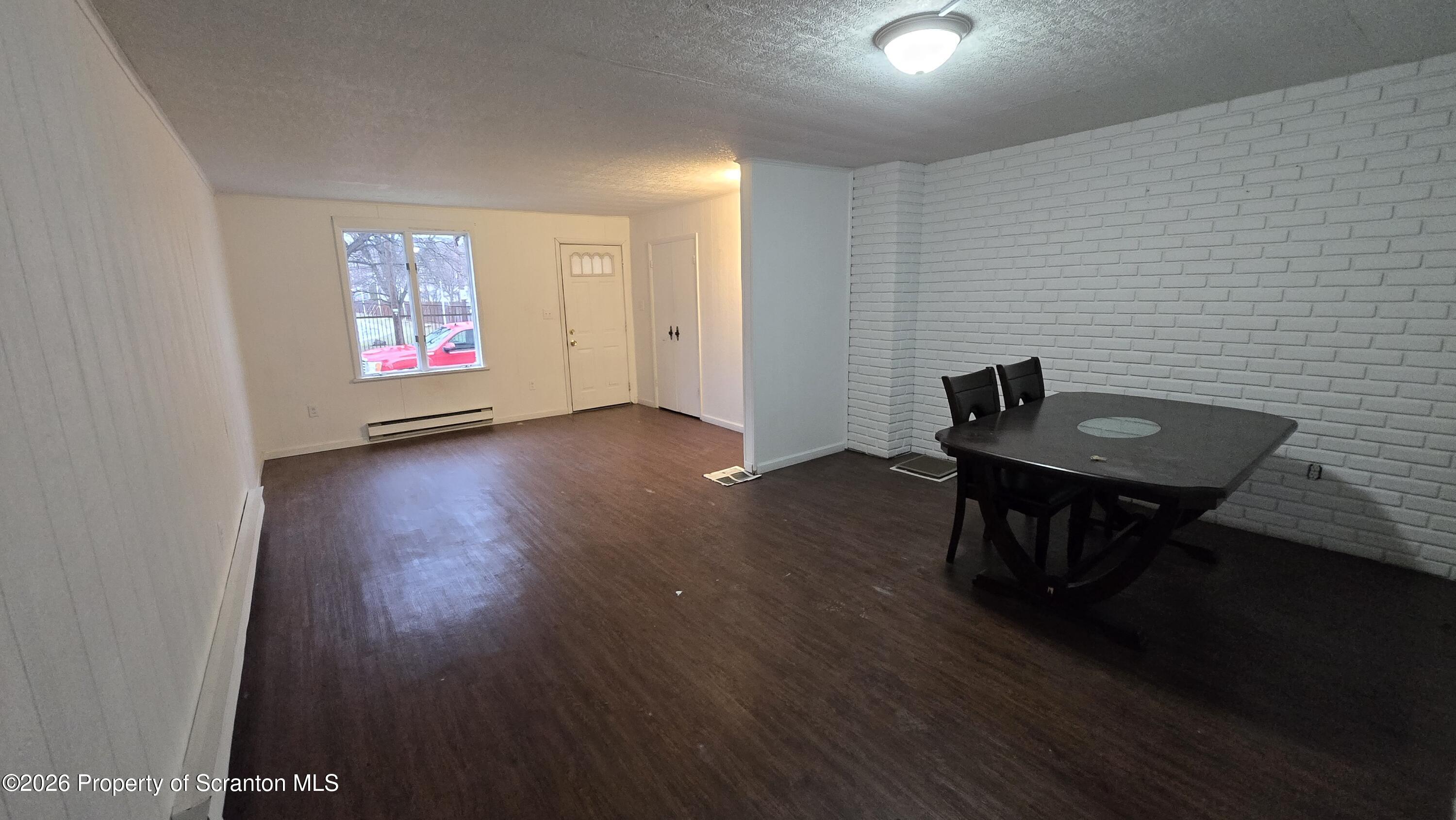1026 Meade Avenue Scranton, PA 18508 - Photo 3 of 12 a view of a livingroom with furniture and wooden floor