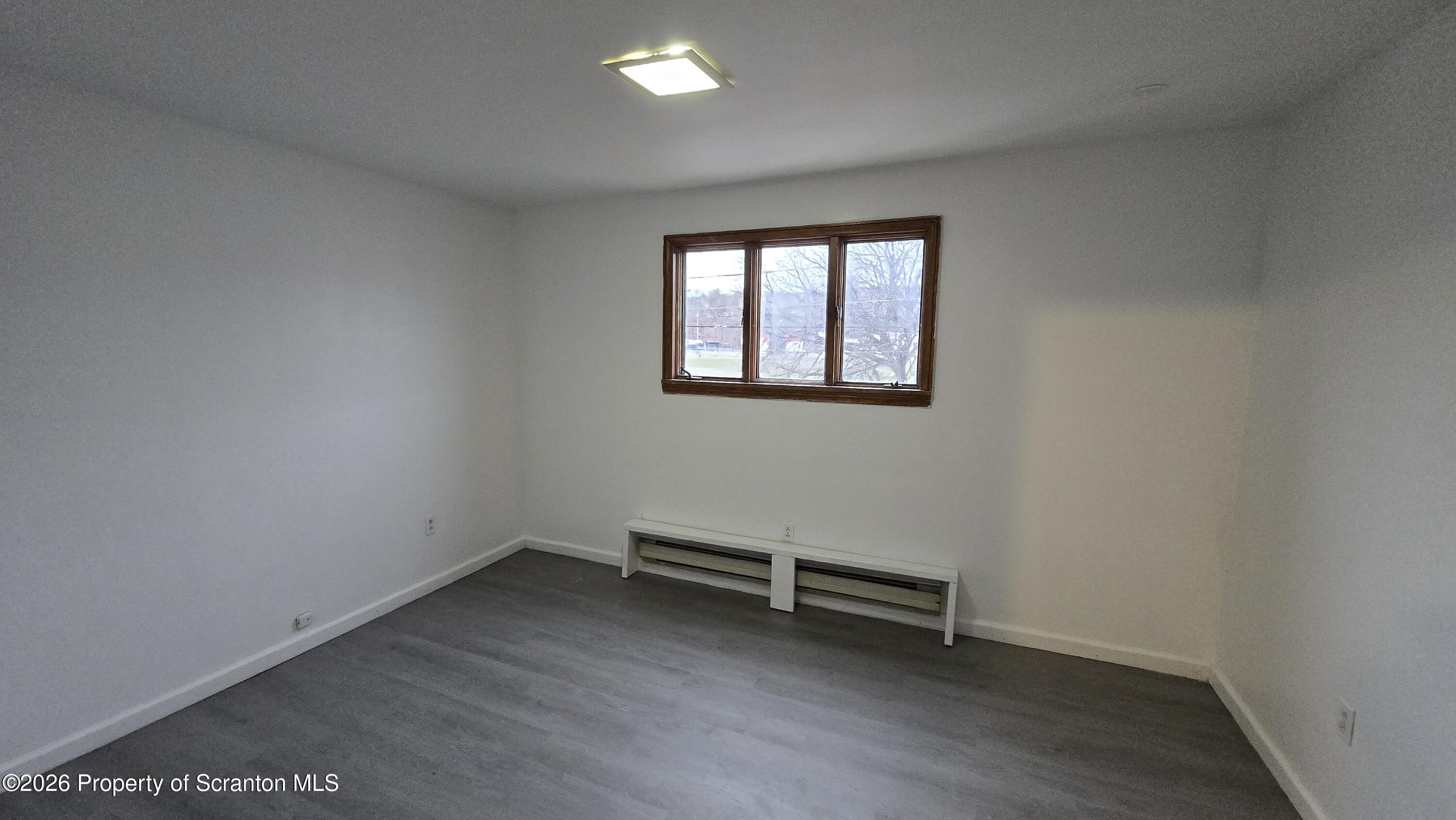 1026 Meade Avenue Scranton, PA 18508 - Photo 7 of 12 an empty room with a window