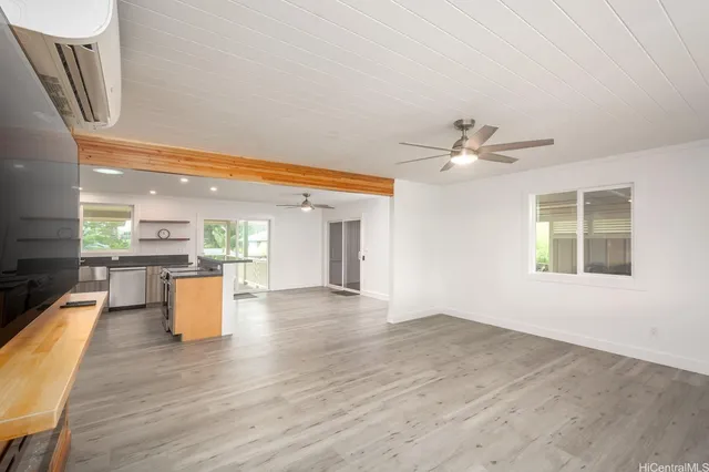 a view of kitchen with furniture and wooden floor