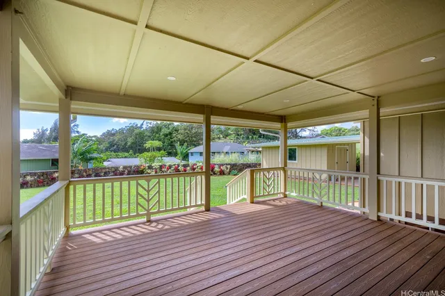 a view of a balcony with wooden floor