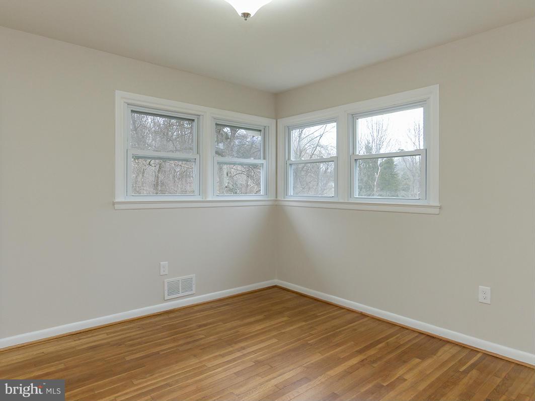 3810 Sweet Air Road Phoenix, MD 21131 - Photo 12 of 30 an empty room with wooden floor and windows