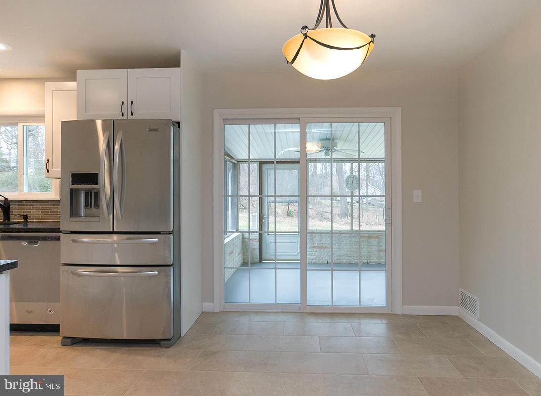 3810 Sweet Air Road Phoenix, MD 21131 - Photo 3 of 30 a kitchen with stainless steel appliances wooden floor and a refrigerator