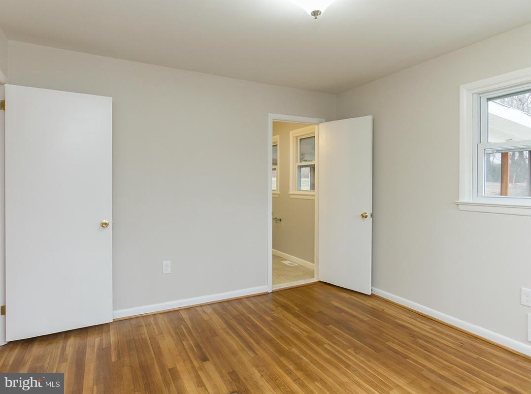 3810 Sweet Air Road Phoenix, MD 21131 - Photo 23 of 30 a view of an empty room with wooden floor and a window