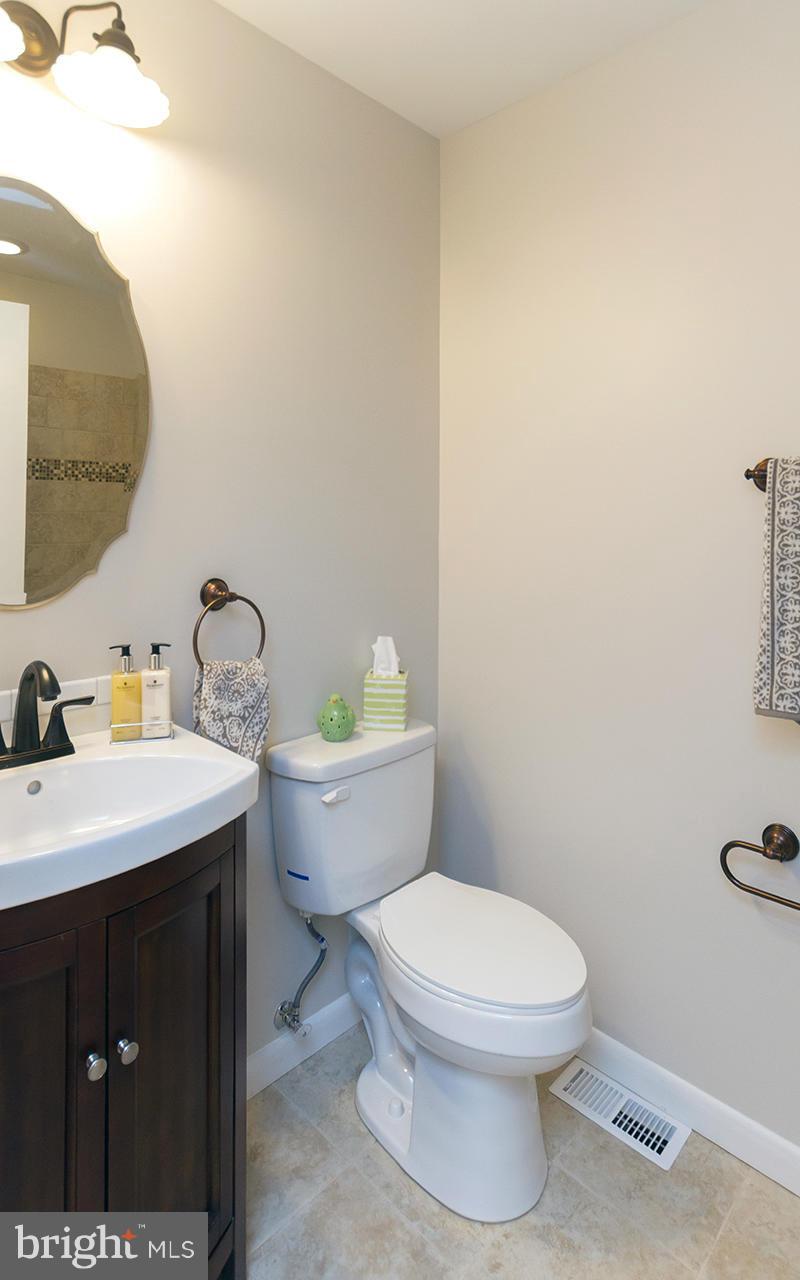 3810 Sweet Air Road Phoenix, MD 21131 - Photo 27 of 30 a bathroom with a toilet a sink and mirror
