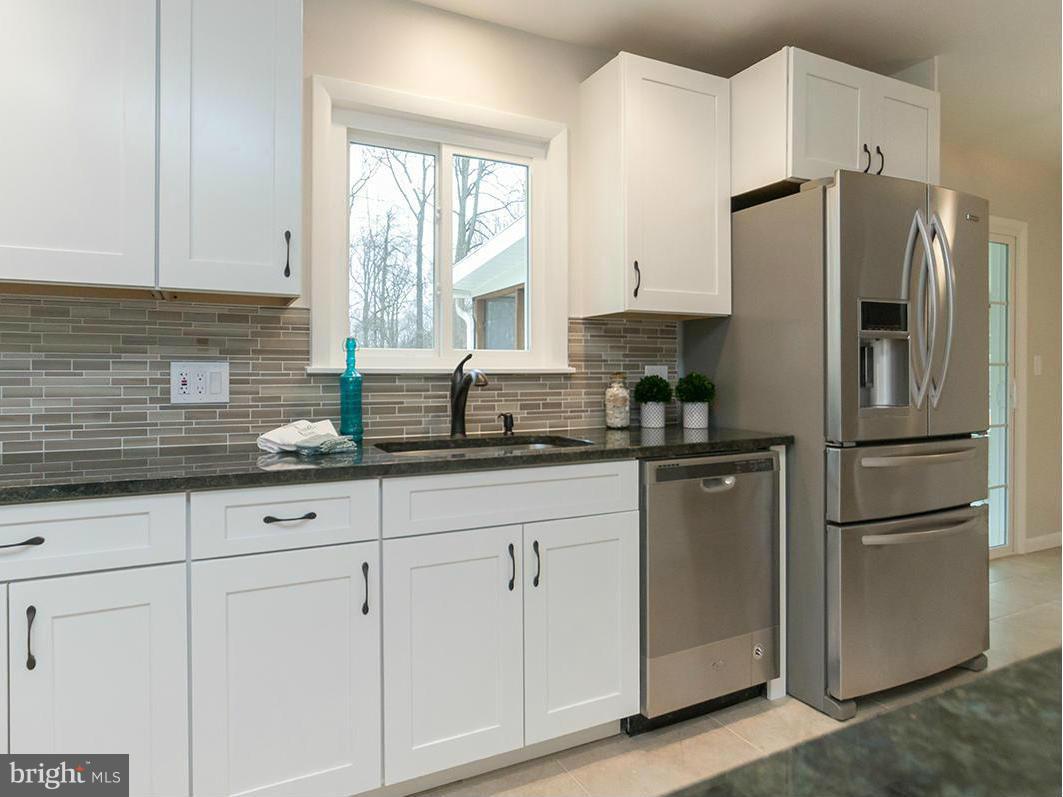 3810 Sweet Air Road Phoenix, MD 21131 - Photo 5 of 30 a kitchen with stainless steel appliances granite countertop a refrigerator sink and white cabinets