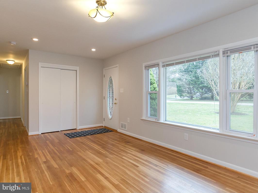3810 Sweet Air Road Phoenix, MD 21131 - Photo 9 of 30 a view of empty room with wooden floor and fan