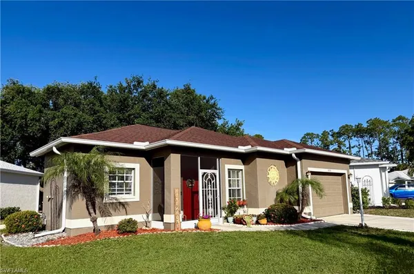 a front view of a house with a yard garden