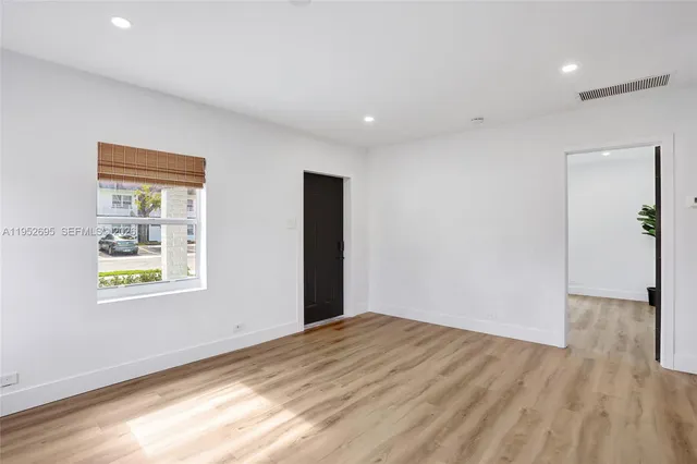 a view of an empty room and window