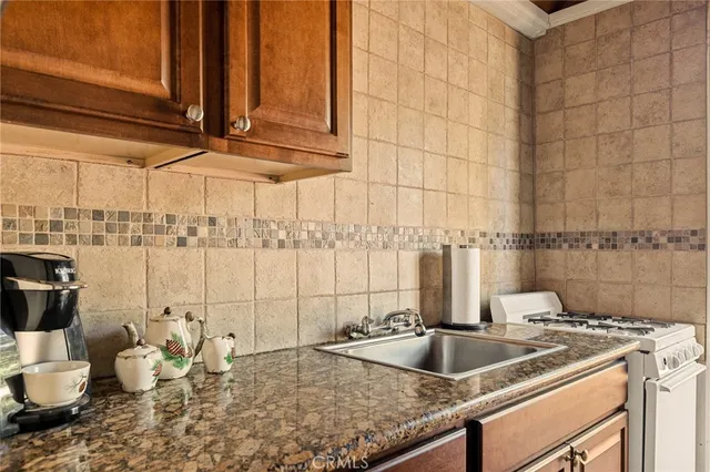 a kitchen with a sink and a stove