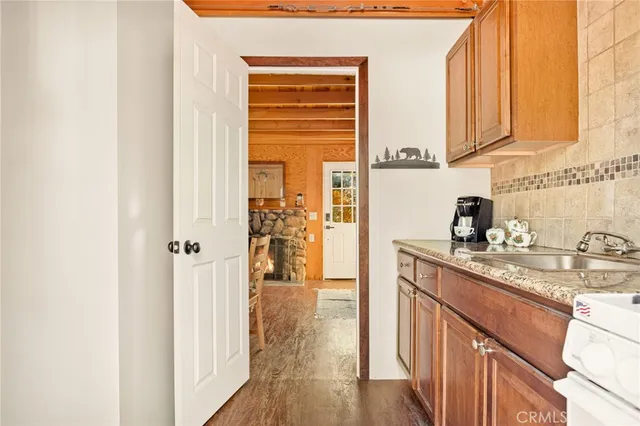 a kitchen with stainless steel appliances granite countertop a sink and cabinets