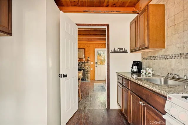 a kitchen with a sink and cabinets