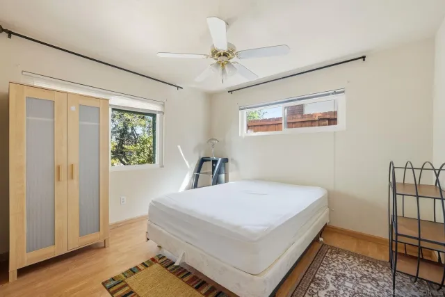 a view of bedroom with a bed and a cabinets