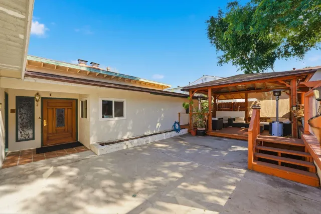 a view of a balcony with wooden floor