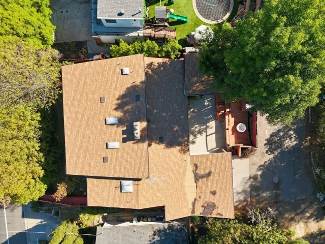 an aerial view of residential houses with outdoor space