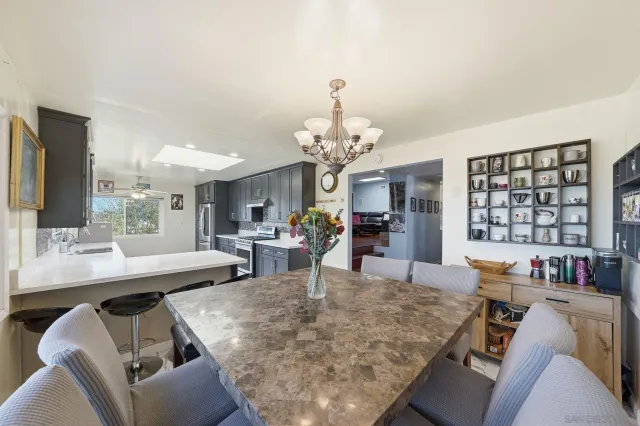a living room with furniture window and wooden floor