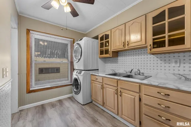 a kitchen with stainless steel appliances granite countertop a sink and cabinets