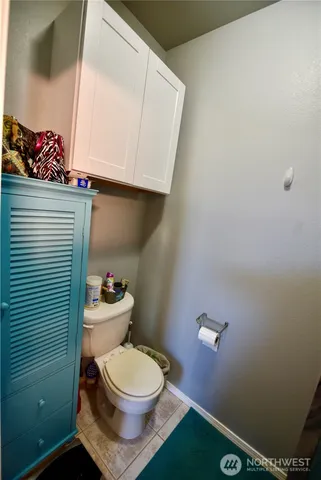 a bathroom with a toilet and a sink