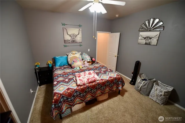 a bedroom with bed and a window