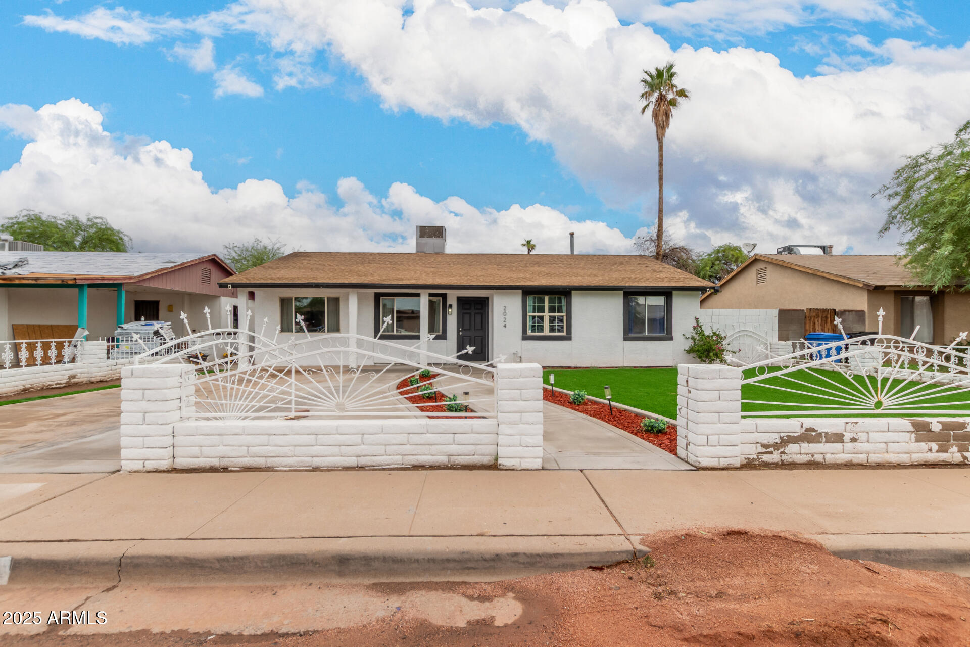 2024 West Roeser Road Phoenix, AZ 85041 - Photo 1 of 36 a front view of a house with a yard