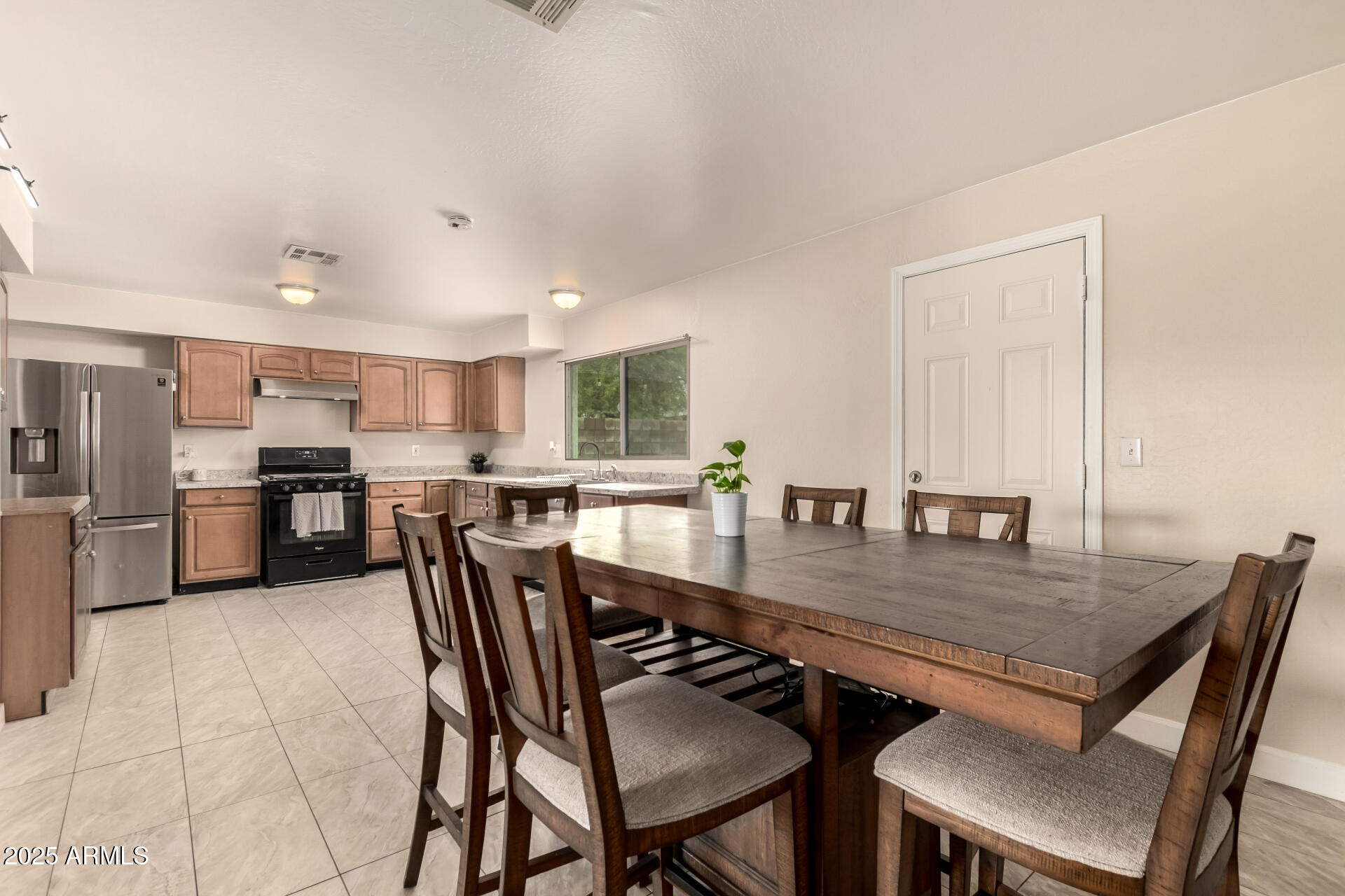 2024 West Roeser Road Phoenix, AZ 85041 - Photo 13 of 36 a dining room with furniture and wooden floor