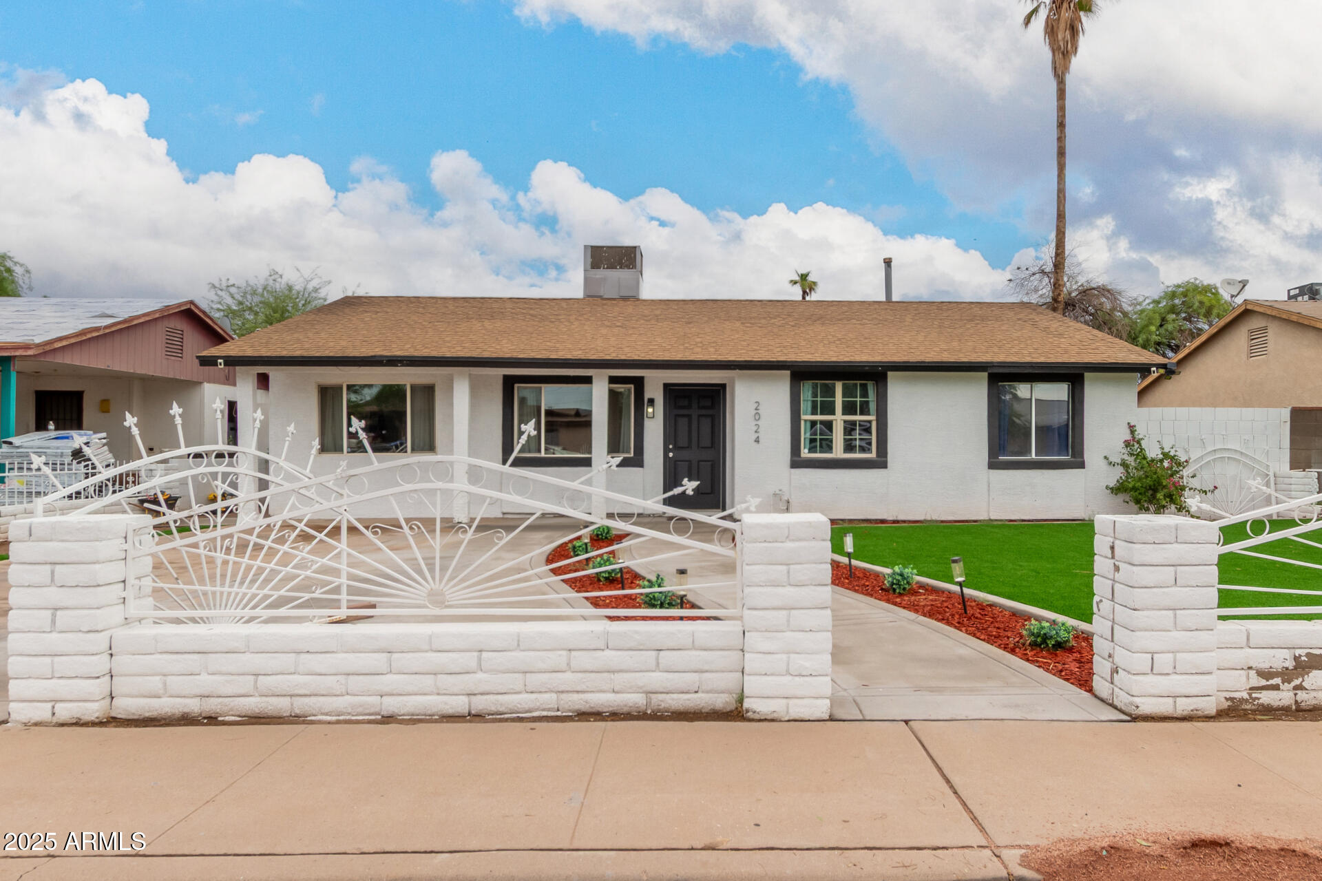 2024 West Roeser Road Phoenix, AZ 85041 - Photo 2 of 36 a front view of a house with garden