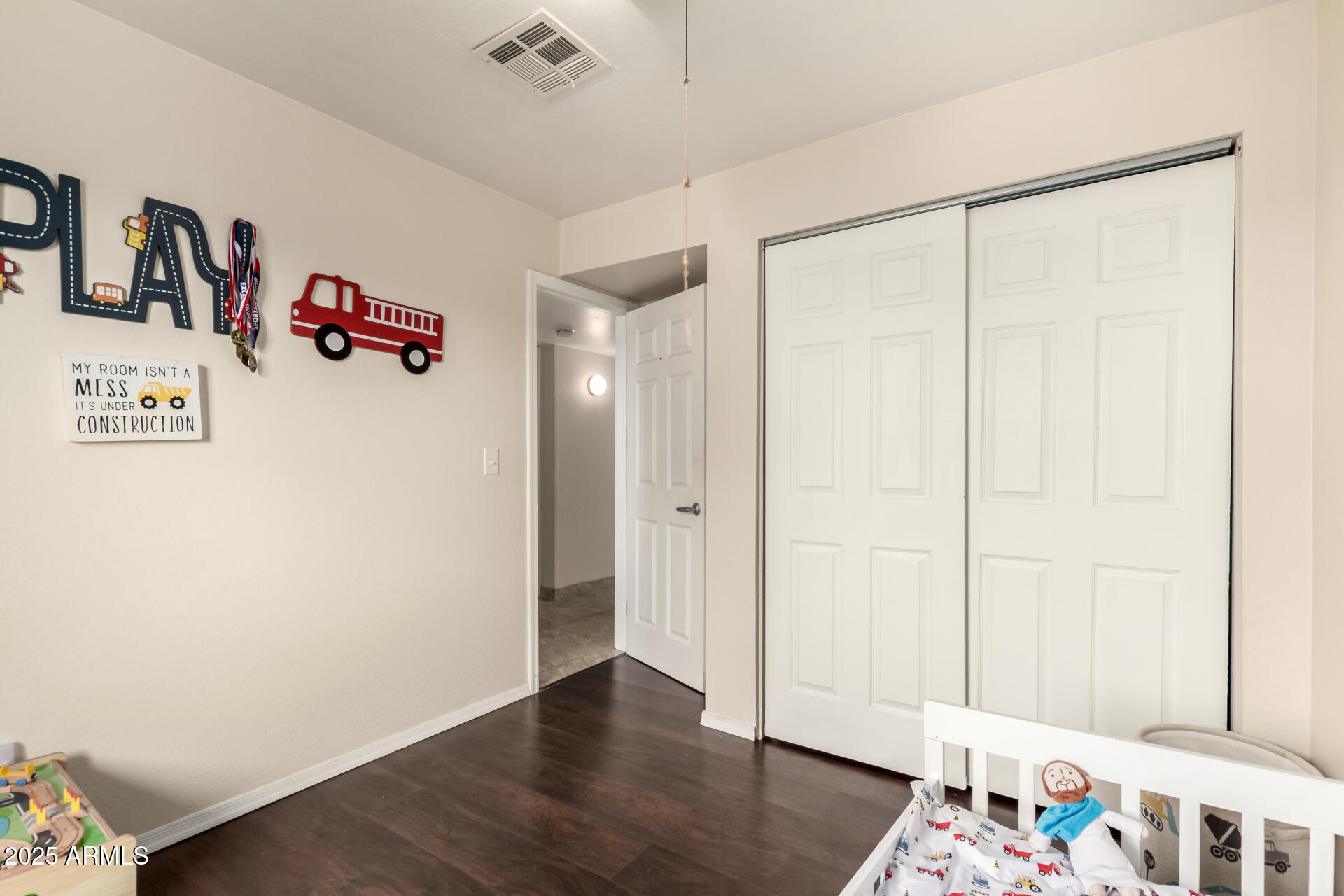 2024 West Roeser Road Phoenix, AZ 85041 - Photo 24 of 36 a very nice looking room with a wooden floor